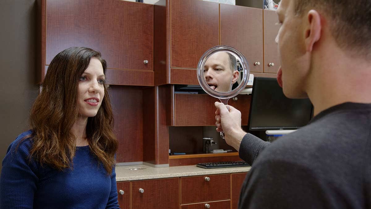 Myofunctional therapist at Govani Dental working with a patient in their Oshkosh office.