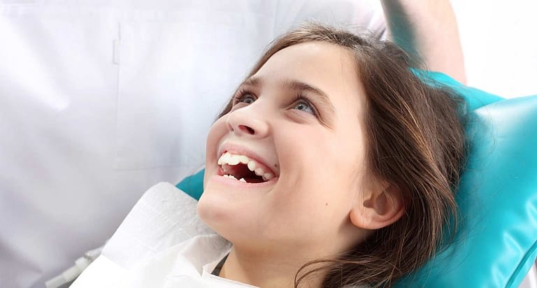 Child dental patient smiling.