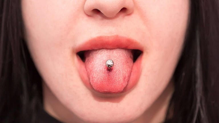 Girl with tongue ring piercing